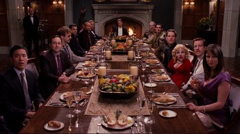 Movie still from “Dinner for Schmucks” (2010), directed by Jay Roach – A group of people sitting around a long dinner table; Wide shot, High angle