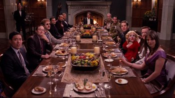 Movie still from “Dinner for Schmucks” (2010), directed by Jay Roach – A group of people sitting around a dinner table; Wide shot, High angle
