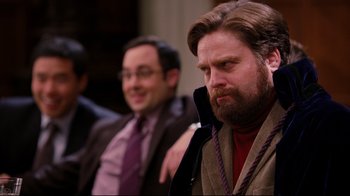 Movie still from “Dinner for Schmucks” (2010), directed by Jay Roach – Two men sitting next to each other in a room; Medium shot, Over the shoulder angle