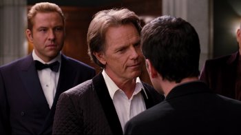 Movie still from “Dinner for Schmucks” (2010), directed by Jay Roach – A man in a black jacket talking to another man in a black jacket; Close Up shot, Over the shoulder angle