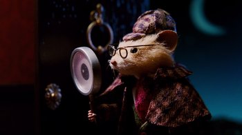 Movie still from “Dinner for Schmucks” (2010), directed by Jay Roach – A stuffed rat dressed as a woman holding a magnifying glass; Close Up shot, High angle