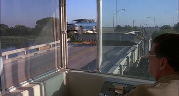 Movie still from “Dirty Mary Crazy Larry” (1974), directed by John Hough – A view of a highway from a window; Wide shot, Over the shoulder angle