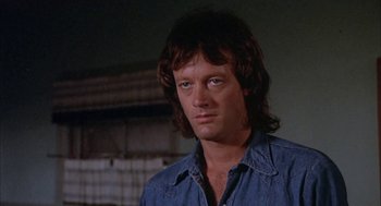 Movie still from “Dirty Mary Crazy Larry” (1974), directed by John Hough – A person with long hair; Close Up shot, Low angle