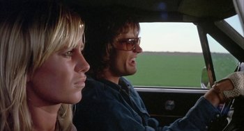 Movie still from “Dirty Mary Crazy Larry” (1974), directed by John Hough – A man and a woman in the back seat of a car; Close Up shot, Low angle