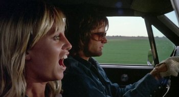 Movie still from “Dirty Mary Crazy Larry” (1974), directed by John Hough – A man and a woman in the back seat of a car; Close Up shot, Low angle