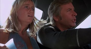 Movie still from “Dirty Mary Crazy Larry” (1974), directed by John Hough – A man and a woman in the back seat of a car; Close Up shot, Low angle