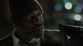 Movie still from “Do You Believe?” (2015), directed by Jon Gunn – A person wearing a bow tie; Close Up shot, Over the shoulder angle