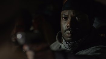 Movie still from “Do You Believe?” (2015), directed by Jon Gunn – A person wearing a hat; Close Up shot, Over the shoulder angle