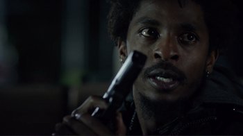 Movie still from “Do You Believe?” (2015), directed by Jon Gunn – A person holding a cell phone up to their face; Close Up shot, Low angle