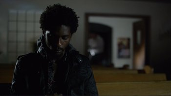 Movie still from “Do You Believe?” (2015), directed by Jon Gunn – A man in a black jacket is looking down; Close Up shot, Low angle