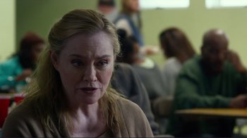 Movie still from “Do You Believe?” (2015), directed by Jon Gunn – A person sitting in front of a group of people; Close Up shot, Over the shoulder angle