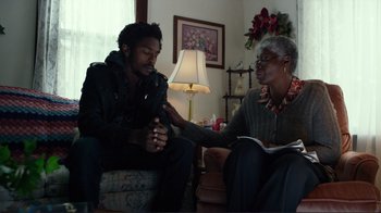 Movie still from “Do You Believe?” (2015), directed by Jon Gunn – An older woman sitting next to a young man; Medium shot, Over the shoulder angle