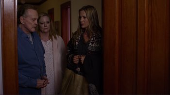 Movie still from “Do You Believe?” (2015), directed by Jon Gunn – Two women standing next to each other near a door; Medium shot, Over the shoulder angle