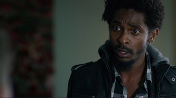 Movie still from “Do You Believe?” (2015), directed by Jon Gunn – A person wearing a jacket; Close Up shot, Over the shoulder angle
