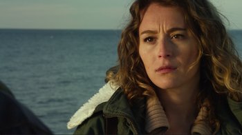 Movie still from “Do You Believe?” (2015), directed by Jon Gunn – A person near a body of water; Close Up shot, Over the shoulder angle