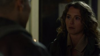 Movie still from “Do You Believe?” (2015), directed by Jon Gunn – A woman looking at a man in the dark; Close Up shot, Over the shoulder angle