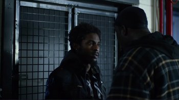 Movie still from “Do You Believe?” (2015), directed by Jon Gunn – Two men standing next to each other in a dark room; Close Up shot, Over the shoulder angle