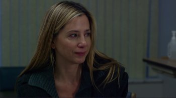 Movie still from “Do You Believe?” (2015), directed by Jon Gunn – A woman with long blonde hair sitting in a room; Close Up shot, Over the shoulder angle