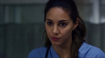 Movie still from “Do You Believe?” (2015), directed by Jon Gunn – A woman in a blue shirt is looking at the camera; Close Up shot, Over the shoulder angle