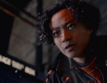 Movie still from “Doctor Who: The Movie” (1996), directed by Geoffrey Sax – A person with curly black hair; Close Up shot, Low angle