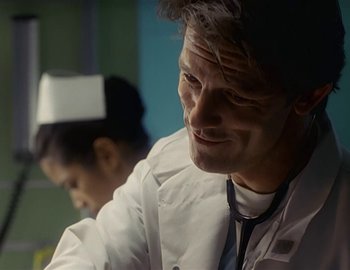 Movie still from “Doctor Who: The Movie” (1996), directed by Geoffrey Sax – A man in a white lab coat and a woman in a white lab coat; Close Up shot, Low angle