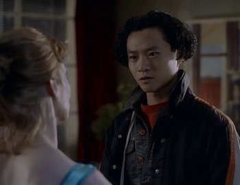 Movie still from “Doctor Who: The Movie” (1996), directed by Geoffrey Sax – A man and a woman are standing in front of each other; Close Up shot, Over the shoulder angle