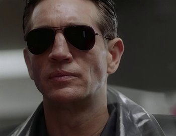 Movie still from “Doctor Who: The Movie” (1996), directed by Geoffrey Sax – A person wearing sunglasses; Close Up shot, Low angle