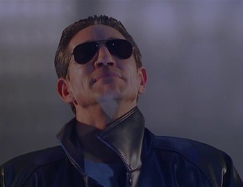 Movie still from “Doctor Who: The Movie” (1996), directed by Geoffrey Sax – A man wearing sunglasses and a leather jacket; Close Up shot, Low angle