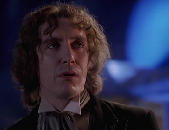 Movie still from “Doctor Who: The Movie” (1996), directed by Geoffrey Sax – A person wearing a suit and tie; Close Up shot, Low angle