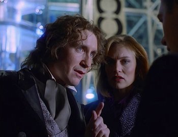 Movie still from “Doctor Who: The Movie” (1996), directed by Geoffrey Sax – A man and a woman standing next to each other; Medium shot, Over the shoulder angle