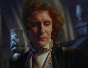 Movie still from “Doctor Who: The Movie” (1996), directed by Geoffrey Sax – A person wearing a suit and tie; Close Up shot, Low angle