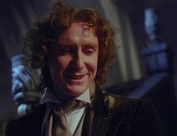Movie still from “Doctor Who: The Movie” (1996), directed by Geoffrey Sax – A person wearing a suit and tie; Close Up shot, Over the shoulder angle