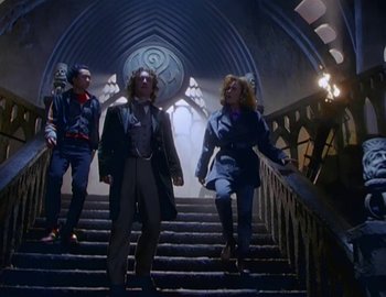 Movie still from “Doctor Who: The Movie” (1996), directed by Geoffrey Sax – A group of people that are walking up some stairs; Wide shot, Low angle