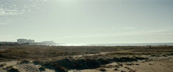 Movie still from “Dogman” (2018), directed by Matteo Garrone – A view of the ocean from the beach; Extreme Wide shot, Low angle