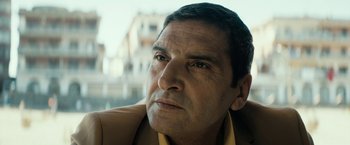 Movie still from “Dogman” (2018), directed by Matteo Garrone – A person wearing a jacket; Close Up shot, Low angle