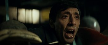 Movie still from “Dogman” (2018), directed by Matteo Garrone – A person with his mouth wide open; Close Up shot, Low angle