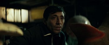 Movie still from “Dogman” (2018), directed by Matteo Garrone – A person wearing a hoodie; Close Up shot, Low angle