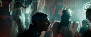 Movie still from “Dogman” (2018), directed by Matteo Garrone – A person wearing a black shirt; Close Up shot, Over the shoulder angle