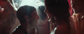 Movie still from “Dogman” (2018), directed by Matteo Garrone – A man and a woman face to face in a dark room; Close Up shot, Over the shoulder angle