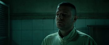 Movie still from “Dogman” (2018), directed by Matteo Garrone – A person wearing a jacket; Close Up shot, Low angle