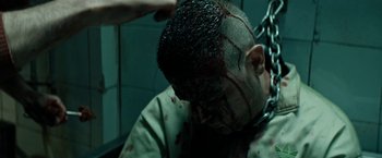 Movie still from “Dogman” (2018), directed by Matteo Garrone – A man with blood all over his face and head; Close Up shot, Over the shoulder angle