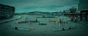 Movie still from “Dogman” (2018), directed by Matteo Garrone – An empty playground in the middle of the night; Extreme Wide shot, High angle