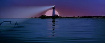 Movie still from “Dolores Claiborne” (1995), directed by Taylor Hackford – A light house on a rock in the ocean; Extreme Wide shot, Low angle