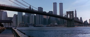 Movie still from “Dolores Claiborne” (1995), directed by Taylor Hackford – A view of a bridge and a city skyline; Extreme Wide shot, Low angle