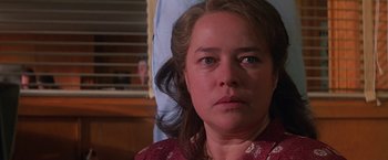 Movie still from “Dolores Claiborne” (1995), directed by Taylor Hackford – A woman's face in front of a window; Close Up shot, Over the shoulder angle