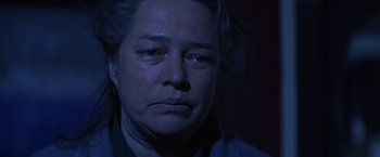 Movie still from “Dolores Claiborne” (1995), directed by Taylor Hackford – A man with a sad look on his face; Close Up shot, Over the shoulder angle