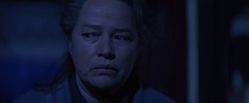Movie still from “Dolores Claiborne” (1995), directed by Taylor Hackford – A person looking at the camera; Close Up shot, Over the shoulder angle