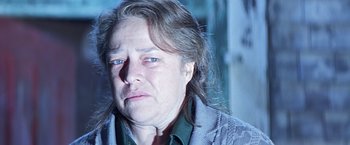 Movie still from “Dolores Claiborne” (1995), directed by Taylor Hackford – An older woman is crying in the dark; Close Up shot, Low angle