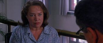 Movie still from “Dolores Claiborne” (1995), directed by Taylor Hackford – A person sitting in a chair; Close Up shot, Over the shoulder angle