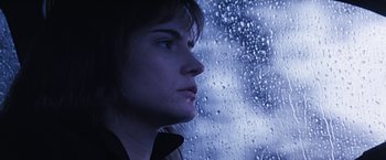 Movie still from “Dolores Claiborne” (1995), directed by Taylor Hackford – A person looking out of a window; Close Up shot, Low angle